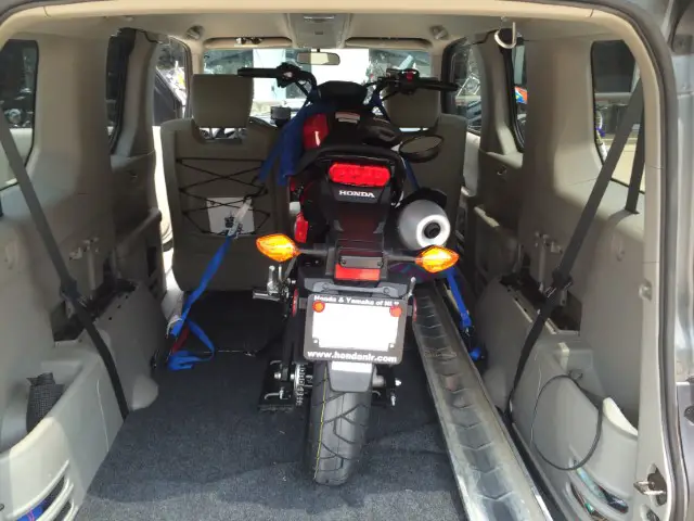 A motorcyle fit inside an SUV