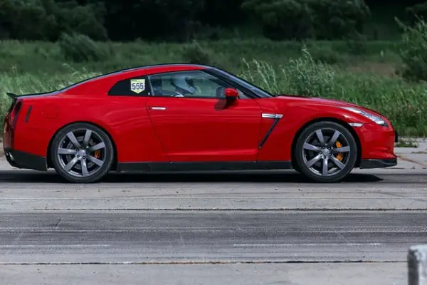 Sporty Gunmetal Rims on Red Car