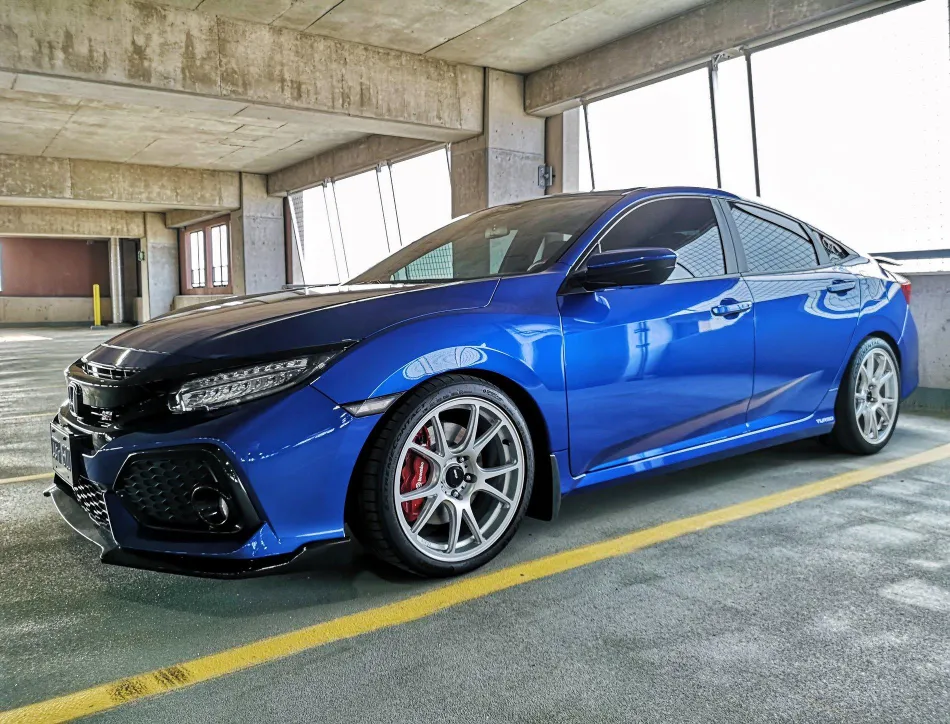 Silver rims on blue car