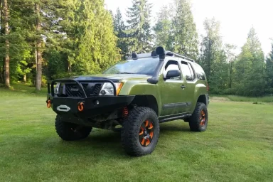 Off Road Nissan Xterra Mods With Giant Wheels and Front Guard Pictures
