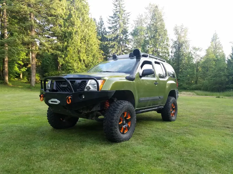 Off Road Nissan Xterra Mods With Giant Wheels and Front Guard Pictures