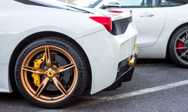 White Car With Bronze Rims and Gold Caliper