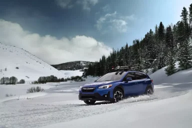 New Subaru Crosstrek driving in the snow