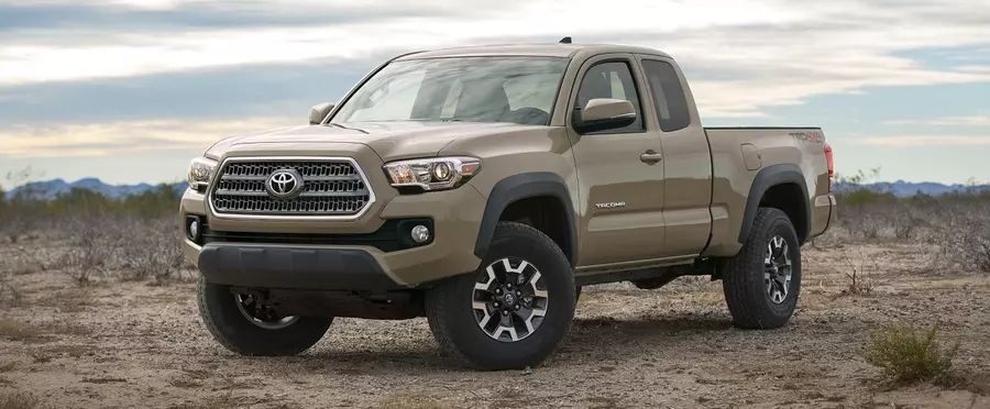 Beige Toyota Tacoma With Dual Tone Wheels