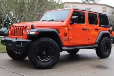 Orange Jeep With Black Wheel