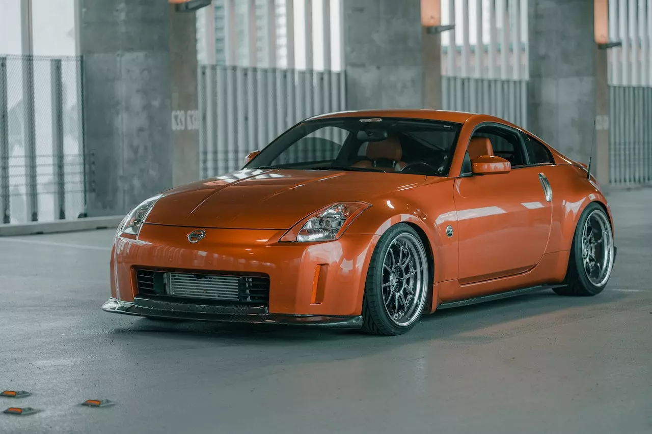 Orange Nissan Sport Car With Gunmetal Rims